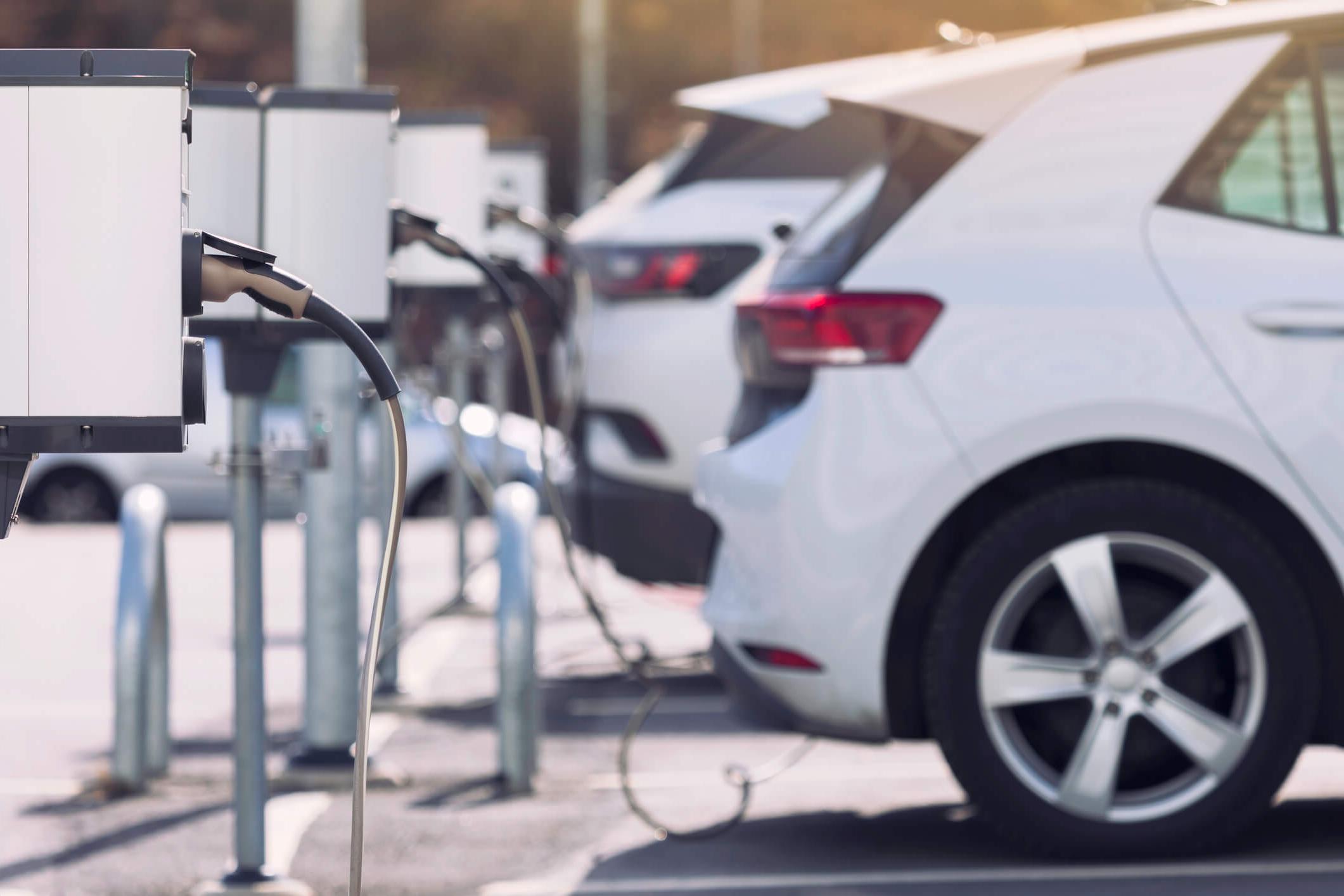 Electric cars charging in a parking lot